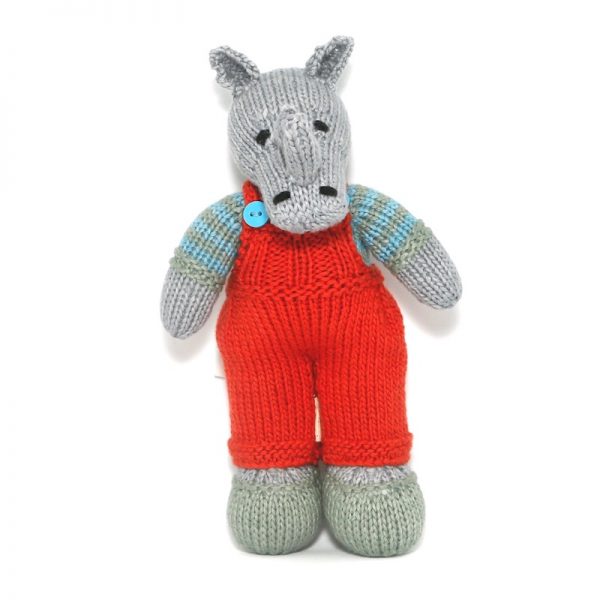 Image of knitted rhino Don wearing brick red dungarees, pale green shoes and blue and khaki striped jersey