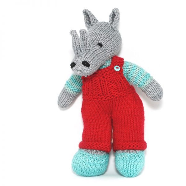 Image of hand knitted rhino Alex in turquoise shoes and jersey with red dungerees